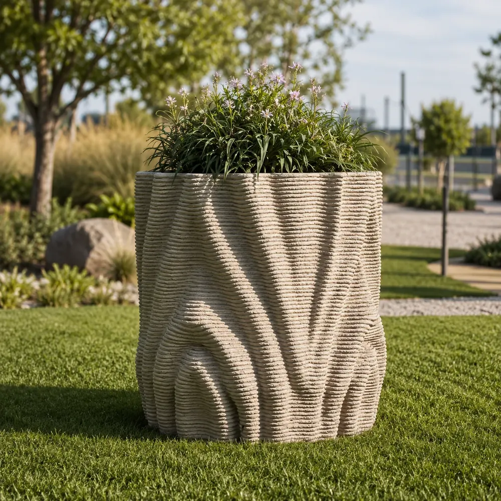 3D printed concrete planter with ribbed organic wave texture in a landscaped garden
